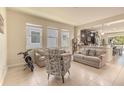 Open floor plan features a spacious living room with tile flooring and tons of natural light at 2820 Avian Loop, Kissimmee, FL 34741