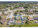 Wide aerial view of a neighborhood showcasing the property's location within a friendly community at 4343 Lake Richmond Dr, Orlando, FL 32811