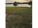 Lush backyard with a glimpse of the serene lake at 4343 Lake Richmond Dr, Orlando, FL 32811