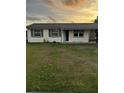 Charming home featuring a well-manicured front yard and inviting curb appeal at 4343 Lake Richmond Dr, Orlando, FL 32811