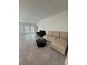 Spacious living room with bright windows, neutral tile, and ample space for furniture at 4812 Worchester Dr, Kissimmee, FL 34746