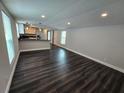 Spacious living room with modern flooring and neutral wall colors creating an open, airy space at 5161 Howison Rd, Kissimmee, FL 34746
