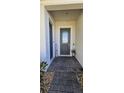 Inviting front entry with stone walkway, decorative 'Welcome' sign, and a modern glass-paneled door at 5340 Jubiloso Dr, St Cloud, FL 34771