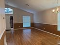Inviting living room featuring hardwood floors, ample natural light, and neutral paint tones at 633 Cypress Tree Ct, Orlando, FL 32825