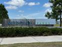 Community welcome sign at Meridian Parks with lush green landscaping at 11713 Tidal Alley Trl, Orlando, FL 32832
