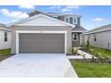 Charming home with a two-car garage and manicured lawn at 6381 Clover St, Lake Hamilton, FL 33851