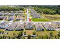 Aerial view of the property, showcasing backyard and neighboring homes in the community at 1907 Partin Terrace Rd, Kissimmee, FL 34744
