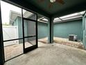 Private outdoor patio with screened door and brick pavers at 4710 Nathan Hale Blvd, St Cloud, FL 34769