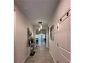 Well decorated entryway featuring contemporary decor and neutral color palette at 9083 Coral Cape St, Kissimmee, FL 34747