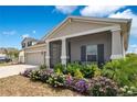 Attractive one-story home features a screened-in porch, well-kept landscaping, and an attached two-car garage at 109 Pineywoods St, St Cloud, FL 34772