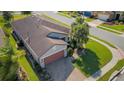 An aerial view of a single-story home showing the well-maintained yard and neighborhood at 1005 Salamanca Pl, Davenport, FL 33837