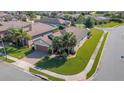 A high angle shot of the home, showing nice landscaping and neighborhood at 1005 Salamanca Pl, Davenport, FL 33837
