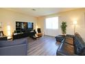 Spacious living room features modern furniture and large window at 1039 Tourmaline Dr, Kissimmee, FL 34746