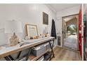 Bright entryway featuring a console table and a view to the front yard through the glass front door at 11242 Stone Gate Ct, Orlando, FL 32837