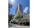 Towering building with a modern design featuring large glass windows, standing tall on a sunny day at 155 S Court Ave # 1308, Orlando, FL 32801