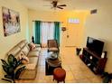 Bright living room with neutral tones, comfortable seating, and stylish accents at 2610 Lodi Cir # 104, Kissimmee, FL 34746