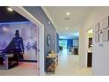 Bright, modern hallway with beautiful tile floors connecting to living spaces at 4213 Paragprah St, Kissimmee, FL 34746