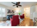 Bright living room with hardwood floors, neutral walls, and plantation shutters offer a stylish, welcoming space at 5101 Staniard Dr, Kissimmee, FL 34746