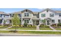 Inviting townhome featuring neat landscaping, a covered entry, and a welcoming facade at 11473 Listening Dr, Orlando, FL 32832