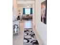 Inviting entryway featuring neutral colors and an elegant rug at 1241 Denali Dr, Winter Haven, FL 33881