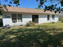 Spacious backyard with a simple patio, offering plenty of room for outdoor activities at 133 Bianca Ct, Kissimmee, FL 34758
