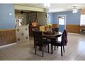 Bright living area with a dining set and an open view to the kitchen and outdoor access at 206 Willow St, Lake Wales, FL 33859