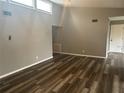 Spacious living room featuring neutral paint, hard surface flooring and natural light at 220 E Desoto St # C, Clermont, FL 34711