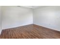 Clean, bright bedroom with wood-style flooring and ample natural light at 250 Beckenham Dr, Kissimmee, FL 34758