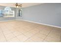 Inviting living room boasting neutral walls, tile flooring, and ample natural light at 2725 N Poinciana Blvd # 147, Kissimmee, FL 34746