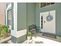 Inviting entryway with a decorative wreath, bench, and neutral-toned accents create a welcoming atmosphere at 2747 Lido Key Dr, Kissimmee, FL 34747