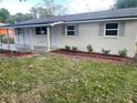 Charming single-story home featuring a fresh white exterior and a covered front porch at 3135 Old Dixie Hwy, Auburndale, FL 33823