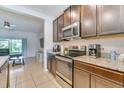 Well-equipped kitchen featuring granite countertops, stainless steel appliances, and ample cabinet space at 314 Annabelle Way, Davenport, FL 33837