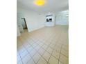 Spacious living area featuring neutral tile flooring and open concept design at 3300 Whitestone Cir # 201, Kissimmee, FL 34741