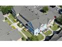 Overhead view of colorful townhouses, showcasing well-maintained lawns and community landscaping at 4004 Santa Maria Dr # 108, Kissimmee, FL 34741