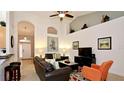 Bright living room features tile flooring, high ceilings, and an open floor plan at 4072 Oaktree Dr, Davenport, FL 33837