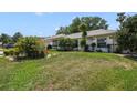 Beautifully maintained lawn and mature landscaping enhance this home's curb appeal at 5137 Links Ln, Leesburg, FL 34748
