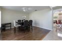 Formal dining room with hardwood floors, stylish seating, and adjacent access to the main living areas at 7716 Park Hill Ave, Leesburg, FL 34748