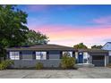 Charming single-story home featuring a well-manicured front yard and a classic blue entry door at 1316 N Bumby Ave, Orlando, FL 32803