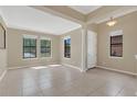 Inviting living room with large windows and neutral wall color offering ample natural light at 2784 Corbel Loop, Kissimmee, FL 34746