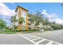 Lovely condo complex with well-maintained landscaping and sidewalks for walking and enjoying the outdoors at 1411 Celebration Ave # 106, Celebration, FL 34747
