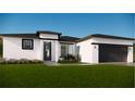 Beautiful new construction home with a modern design, manicured lawn, and beautiful landscaping at 16837 Sw 47Th Court Rd Rd, Ocala, FL 34473