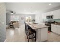 This open-concept kitchen features granite countertops and opens to the living room and dining area at 1809 Bluepoint St, St Cloud, FL 34771