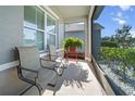 Enjoy a relaxing screened patio with comfortable seating and picturesque outdoor views at 1809 Bluepoint St, St Cloud, FL 34771