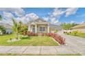 Beautiful single-Gathering home with a landscaped front yard and an attached three-car garage at 3191 Marshfield Preserve Way, Kissimmee, FL 34746
