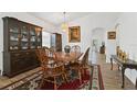 Formal dining room with wood furniture and large china cabinet at 4611 Eaglet Ln, Kissimmee, FL 34746