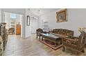 Bright living room with carved wood furniture and tile floors at 4611 Eaglet Ln, Kissimmee, FL 34746