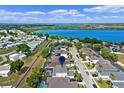 Panoramic aerial view of the community, highlighting the lake and neighborhood at 615 Copeland Dr, Haines City, FL 33844