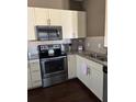 Modern kitchen featuring stainless steel appliances and stylish cabinetry at 8981 Shine Dr, Kissimmee, FL 34747