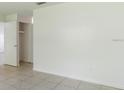 Bright living room featuring neutral paint and tile flooring, offering a blank canvas for personal design at 12513 Indiana Woods Ln, Orlando, FL 32824