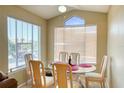 Bright dining area with large windows and comfortable seating for Gathering meals at 2203 Key West Ct # 432, Kissimmee, FL 34741